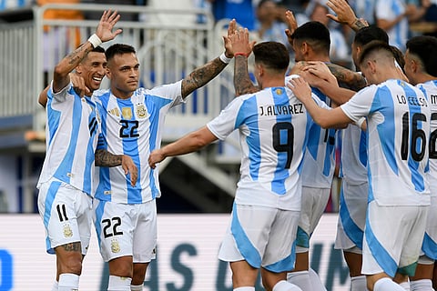 Argentina players celebrate after scoring their first goal